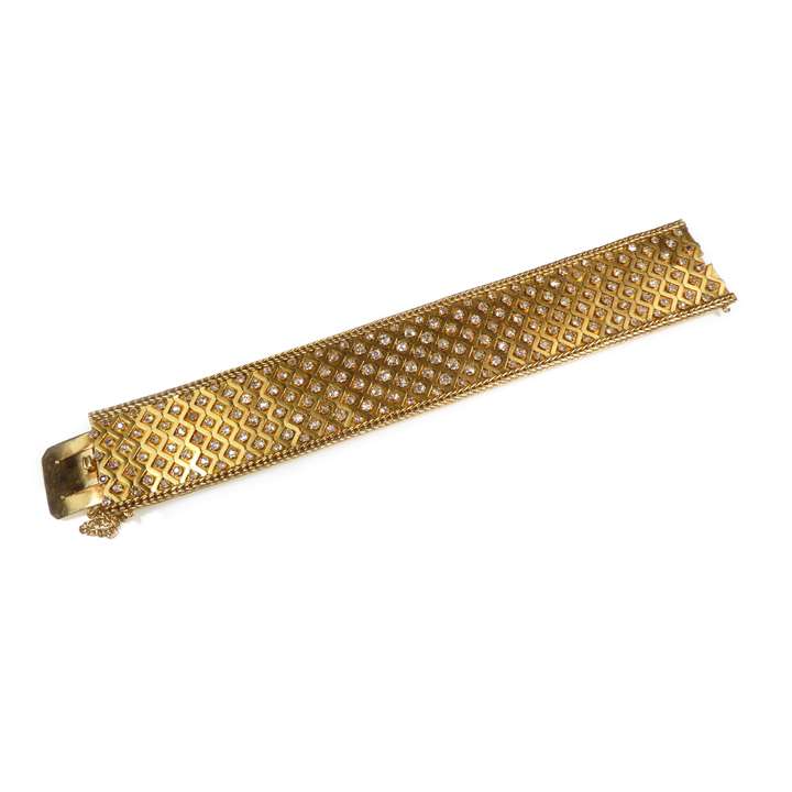 Articulated gold and diamond broad strap bracelet